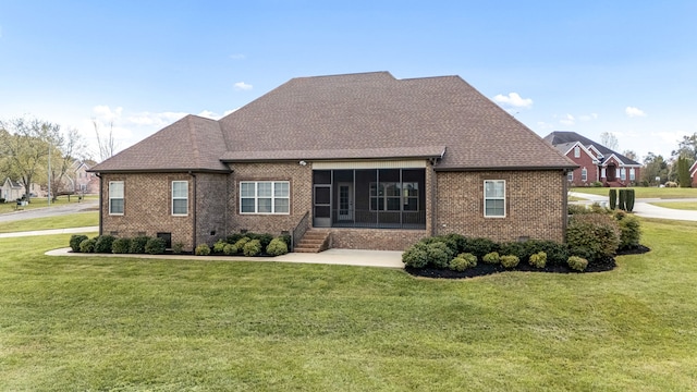 back of property with a sunroom and a lawn