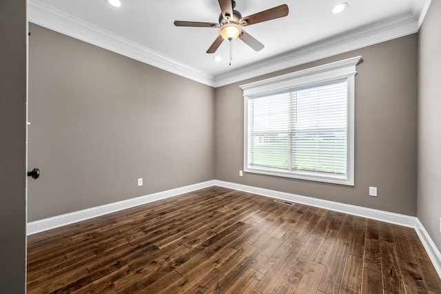 empty room featuring dark hardwood / wood-style floors, ceiling fan, and crown molding