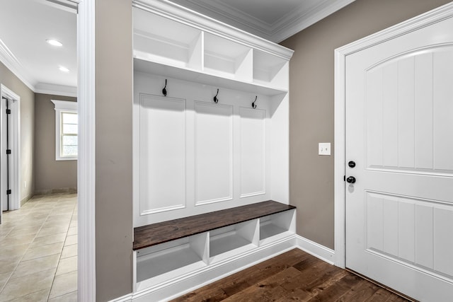 mudroom featuring ornamental molding and light hardwood / wood-style flooring