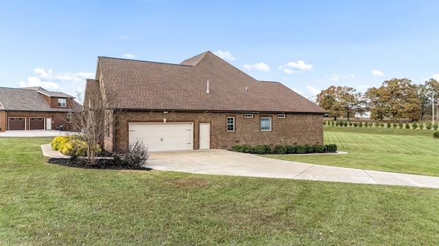 view of side of home featuring a lawn and a garage