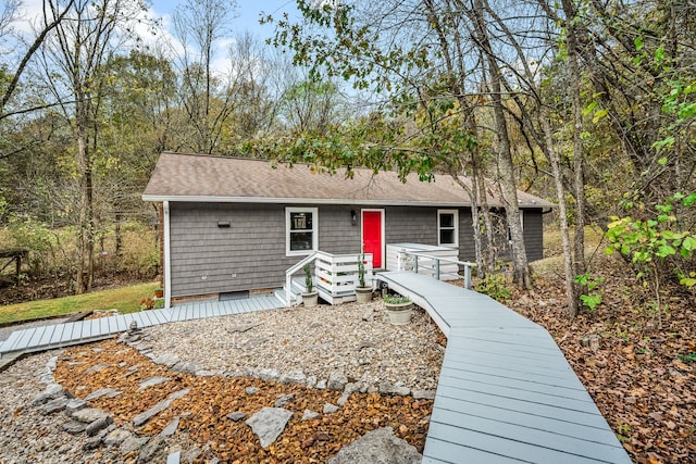 single story home featuring a deck