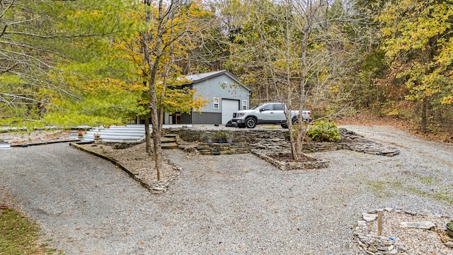 exterior space featuring an outdoor structure and a garage