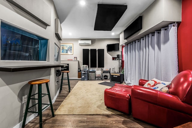 living room featuring an AC wall unit and dark hardwood / wood-style floors