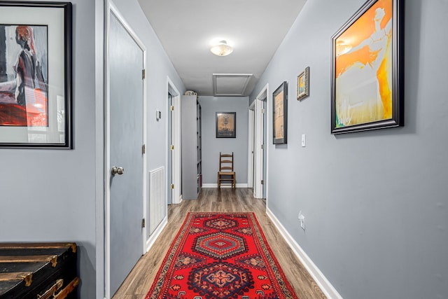 corridor featuring wood-type flooring