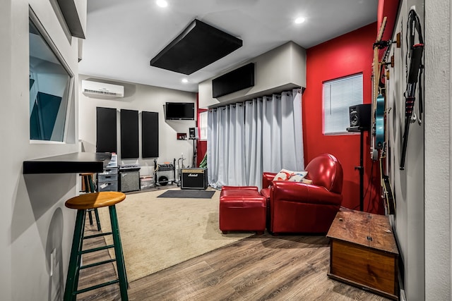 living room with wood-type flooring and a wall mounted AC