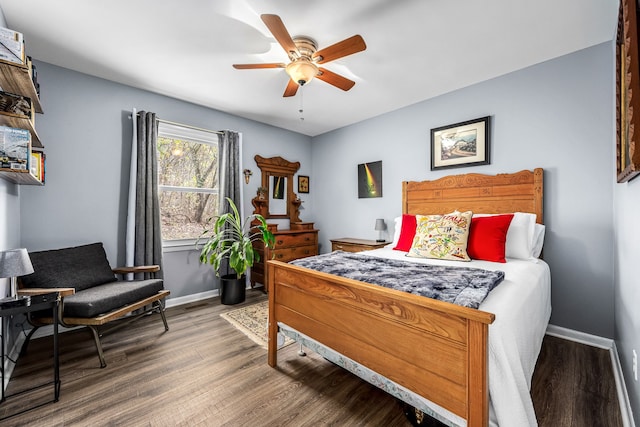 bedroom with ceiling fan and dark wood-type flooring