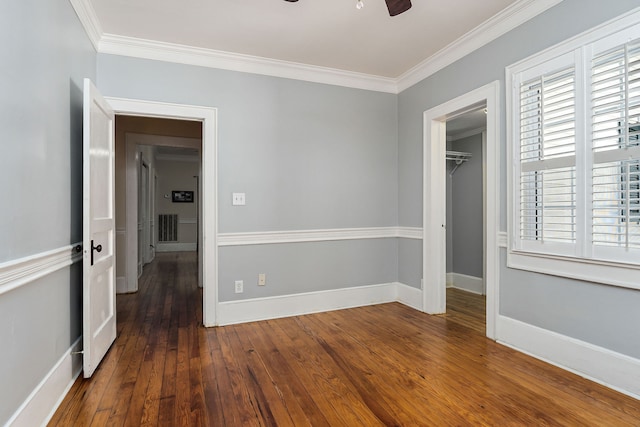 unfurnished room with ceiling fan, dark hardwood / wood-style floors, and ornamental molding