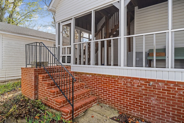 view of side of property with a sunroom