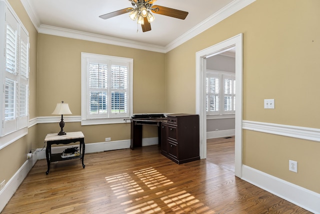 office area featuring wood-type flooring, ceiling fan, and ornamental molding