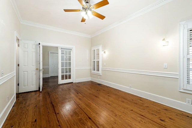 spare room with hardwood / wood-style floors, ceiling fan, and crown molding