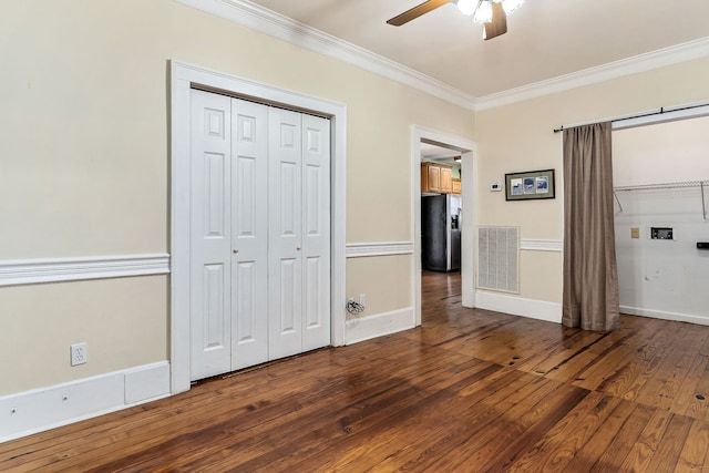 unfurnished bedroom with stainless steel refrigerator with ice dispenser, dark hardwood / wood-style floors, ceiling fan, and crown molding