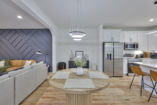 dining room with light hardwood / wood-style flooring