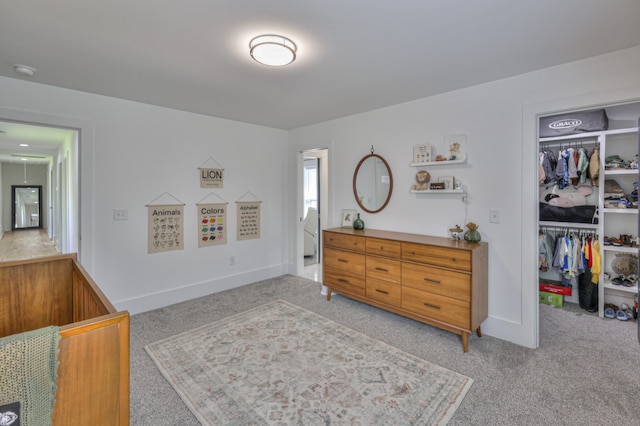 carpeted bedroom with a closet