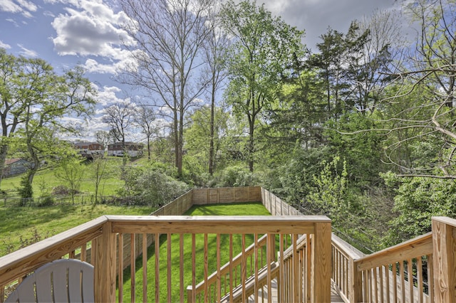 wooden terrace with a yard