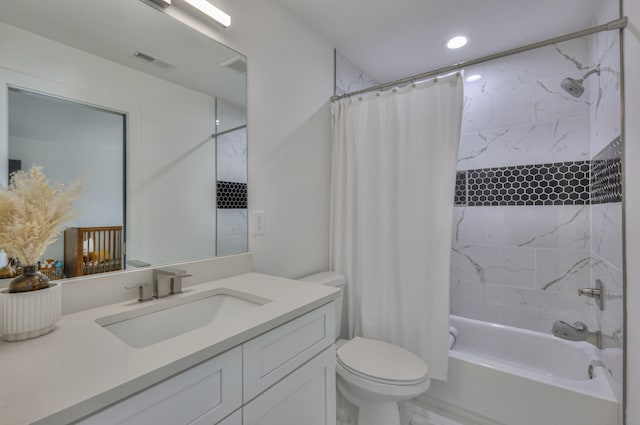 full bathroom featuring vanity, toilet, and shower / bath combo