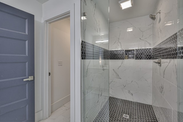 bathroom with a tile shower