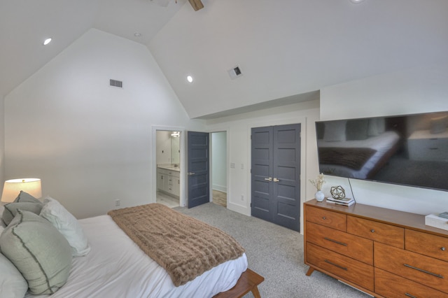 bedroom featuring connected bathroom, ceiling fan, high vaulted ceiling, light colored carpet, and a closet