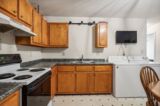 kitchen with sink, white electric stove, a barn door, a textured ceiling, and washing machine and clothes dryer