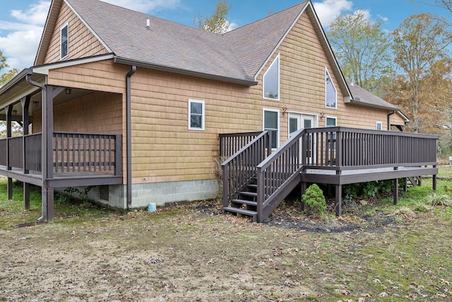 back of house with a wooden deck