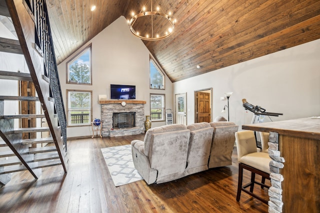 living room with wooden ceiling, dark hardwood / wood-style flooring, high vaulted ceiling, a chandelier, and a fireplace