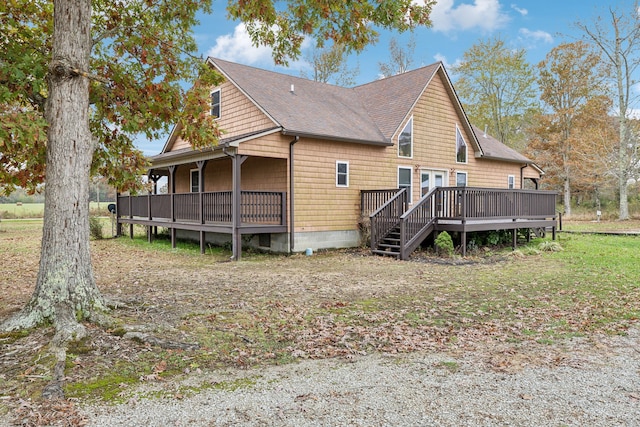 rear view of house with a wooden deck