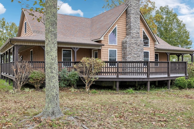 rear view of property with a deck