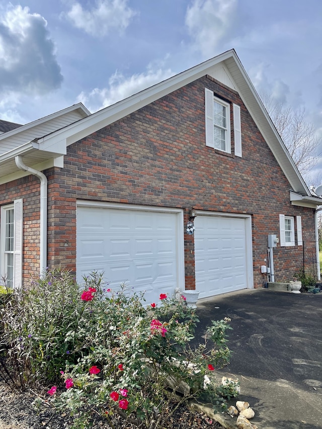 view of property exterior featuring a garage