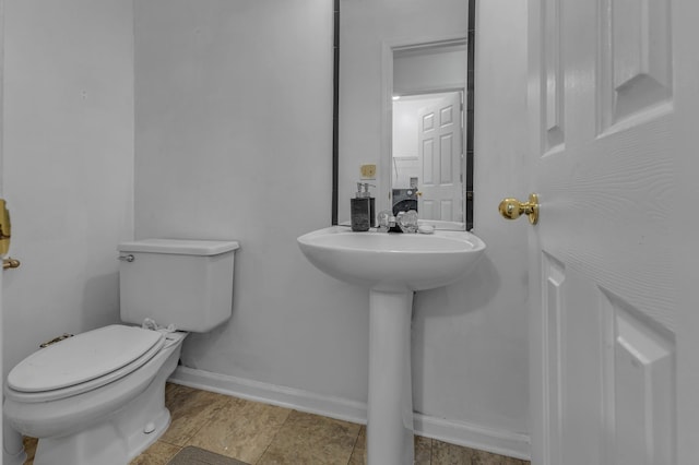 bathroom featuring tile patterned floors, sink, and toilet