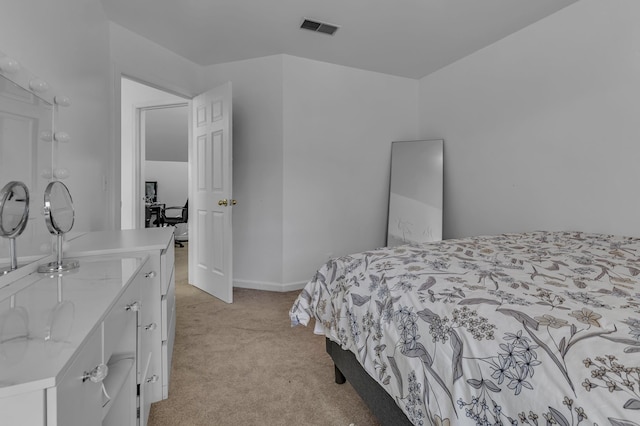 bedroom featuring light carpet