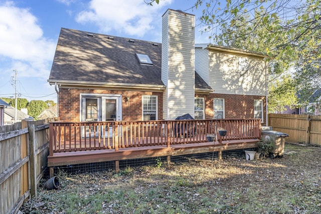 rear view of house with a deck