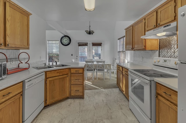 kitchen featuring french doors, white appliances, sink, and tasteful backsplash