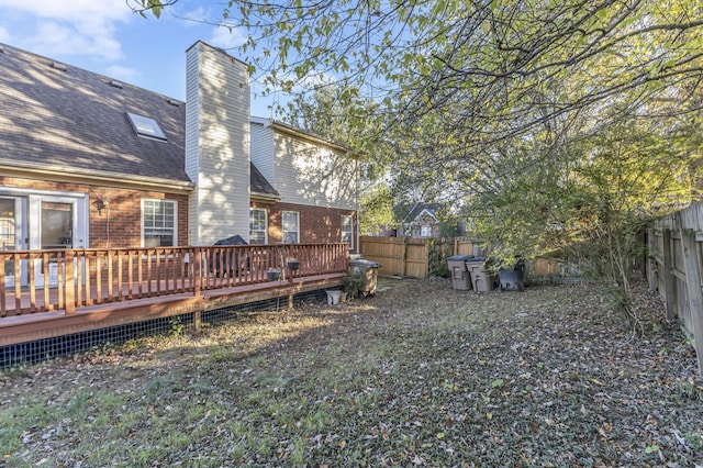 view of yard featuring a wooden deck