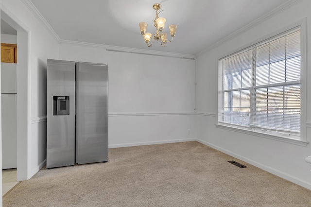 unfurnished dining area with light carpet, a chandelier, and ornamental molding