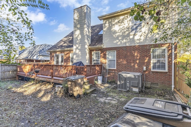 back of property with cooling unit and a wooden deck