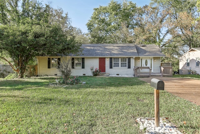 ranch-style house featuring a front lawn