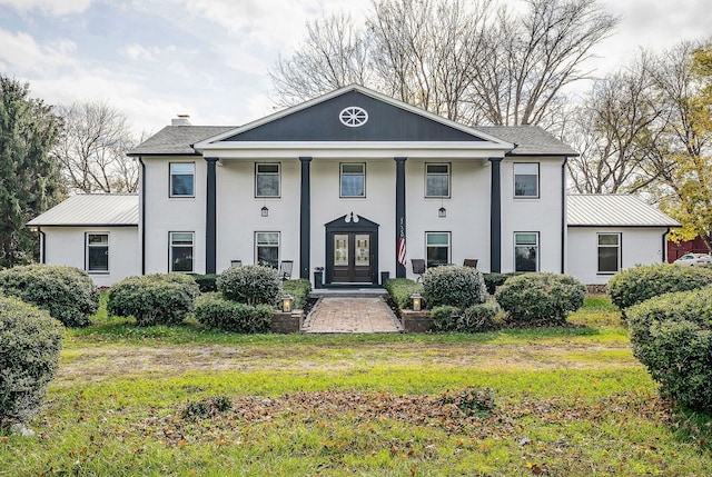 greek revival inspired property featuring french doors