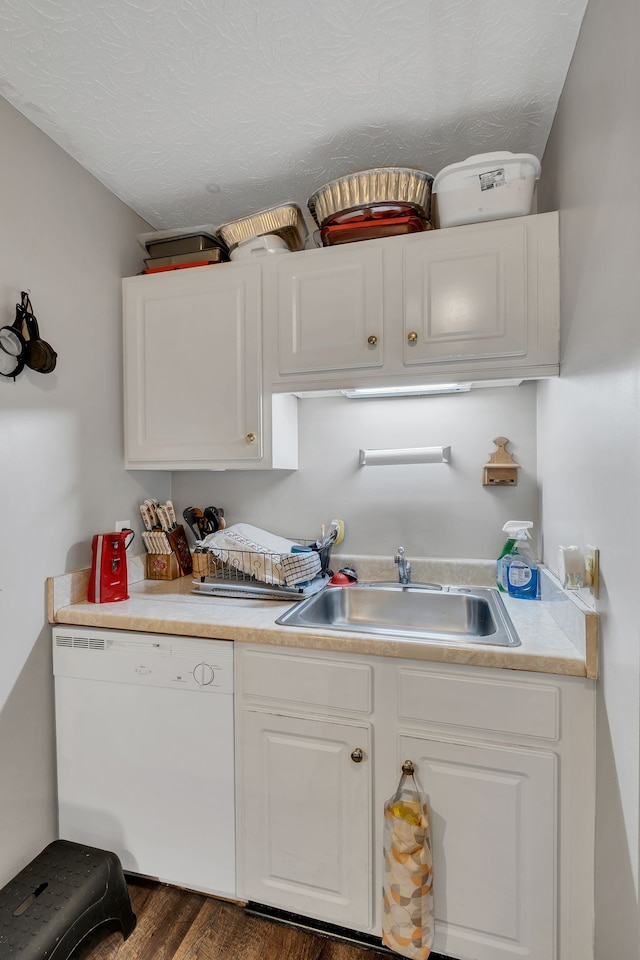 kitchen featuring white dishwasher, white cabinets, sink, a textured ceiling, and dark hardwood / wood-style flooring