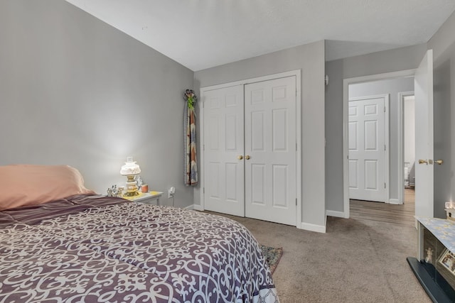 carpeted bedroom with a closet