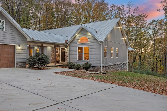 4955 Ringgold Rd, La Fayette, GA 30728 - view of front of home with a porch, a metal roof, concrete driveway, and a garage