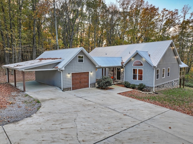 ranch-style home with a garage and a carport