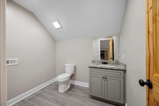4955 Ringgold Rd, La Fayette, GA 30728 - bathroom featuring vanity, toilet, and lofted ceiling