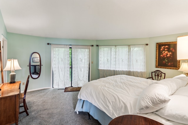 carpeted bedroom featuring multiple windows