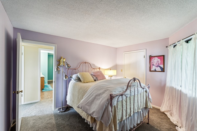 carpeted bedroom with a textured ceiling