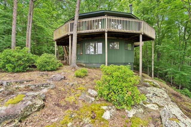 view of side of property with a wooden deck