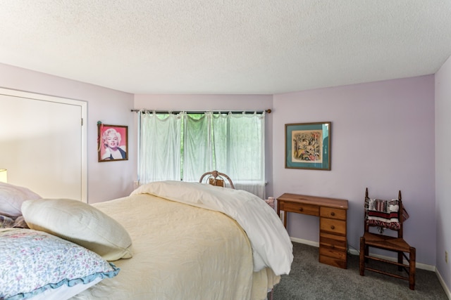 carpeted bedroom with a textured ceiling