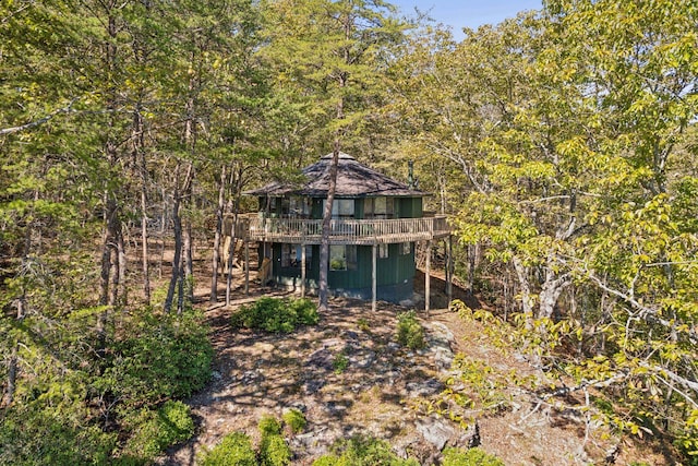 rear view of property featuring a gazebo