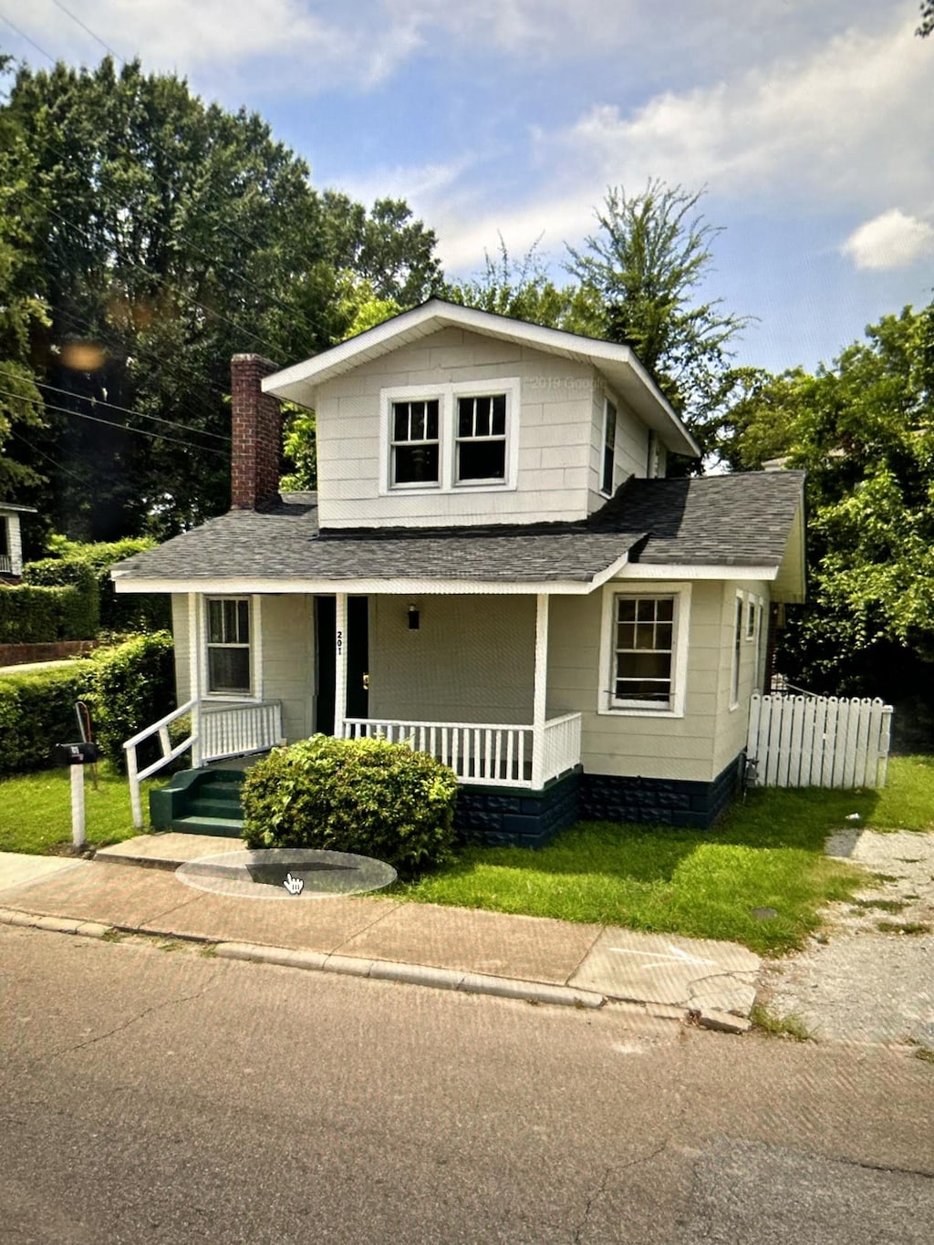 201 N Hays Ave, Jackson, TN 38301 - view of front of house with a shingled roof, covered porch, and a chimney