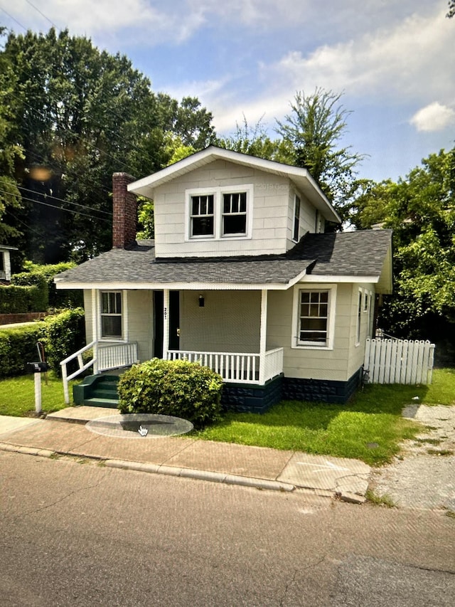201 N Hays Ave, Jackson, TN 38301 - view of front of house with a shingled roof, covered porch, and a chimney