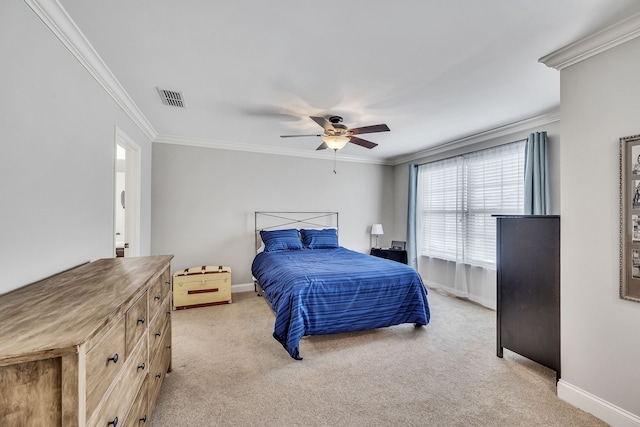 carpeted bedroom with ceiling fan and ornamental molding