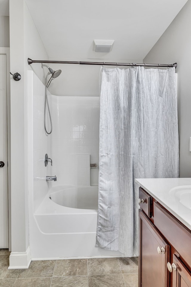 bathroom featuring vanity, tile patterned floors, and shower / bathtub combination with curtain